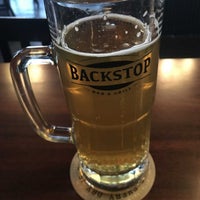 Photo taken at Backstop Bar &amp;amp; Grill by Chris R. on 3/17/2023