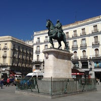 Photo taken at Puerta del Sol by T. M. on 4/18/2013