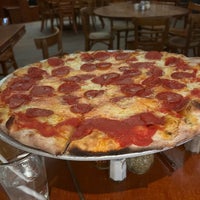 Photo taken at John&amp;#39;s Pizzeria by J.C. B. on 10/12/2023