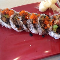 Photo taken at Sushi Kura by Fernanda A. on 1/9/2014