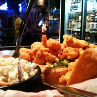Photo taken at Shucks Fish House &amp;amp; Oyster Bar by Jason E. on 6/30/2012