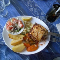 Photo taken at Takis Taverna by Eda B. on 8/24/2012