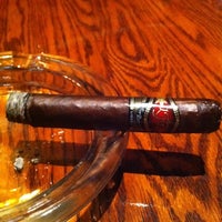 Photo taken at Downing Street Pub &amp;amp; Cigar Bar by Ty H. on 3/31/2012