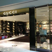 Photo taken at Gucci by Irene M. on 3/10/2013