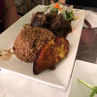 Photo taken at Yardie Spice by Adrienne S. on 6/23/2018