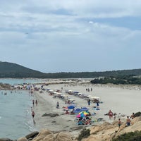 Photo taken at Spiaggia di Porto Giunco by Alessandro G. on 6/25/2022