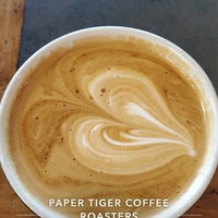Photo taken at Paper Tiger Coffee Roasters by Austin G. on 6/10/2019
