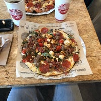 Photo taken at PizzaRev by robert l. on 5/5/2019