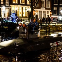 Photo taken at Amsterdam Christmas Canal Parade by Arnold on 12/15/2012