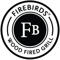 Photo taken at Firebirds Wood Fired Grill by Yext Y. on 12/27/2018