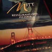 Photo taken at The Mitt Restaurant, Bar &amp;amp; Pizzeria by Douglas G. on 5/12/2013