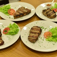 Photo taken at Restaurante Dom Pimenta (argentino/steakhouse/brasileiro) by Restaurante Dom Pimenta (argentino/steakhouse/brasileiro) on 7/13/2014