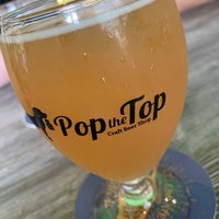 Photo taken at Pop the Top Craft Beer Shop by Rich W. on 8/28/2022