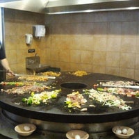 Photo taken at bd&amp;#39;s Mongolian Grill by Jeanette A. on 7/8/2012