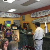 Photo taken at Surfin Donuts by Aileen B. on 9/26/2015