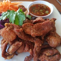 Photo taken at Moo Moo Thai Cafe by Joseph C. on 12/5/2014