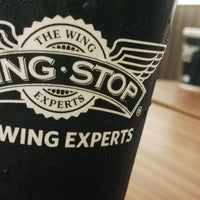 Photo taken at WING•STOP by Andhi Tri S. on 11/23/2014