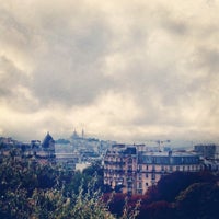 Photo taken at Parc des Buttes-Chaumont by Andrew C. on 5/26/2015