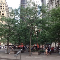 Photo taken at Zuccotti Park by Hao W. on 7/18/2015