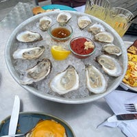 Photo taken at Bridge Restaurant [Raw Bar] and River Patio by Kaitlyn S. on 5/8/2021