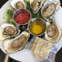 Photo taken at The Oyster Farm Seafood Eatery by Thilina R. on 9/2/2018