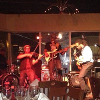 Photo taken at Acoustix Jazz Restaurant And Lounge by Denitia F. on 3/22/2013