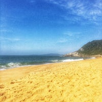 Photo taken at Praia do Estaleiro by Raquel on 5/10/2018