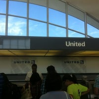 Photo taken at Gate A21 by Michael M. on 6/13/2012