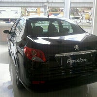 Photo taken at Peugeot Merci by Vanessa V. on 8/27/2012