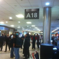 Photo taken at Gate A18 by Chris I. on 3/11/2012