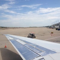Photo taken at Gate C10 by Venice B. on 7/19/2012