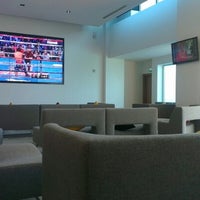 Photo taken at The Club lounge by Tagi T. on 6/22/2012