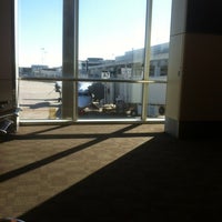 Photo taken at Gate A7 by Bryan S. on 2/11/2012