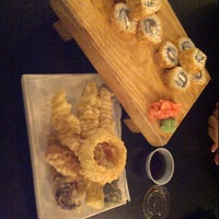 Photo taken at Inoko Sushi Express by Giovanna F. on 1/31/2012