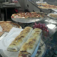 Photo taken at Tony&#39;s Pizza by Michelangelo R. on 11/30/2011