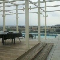 Photo taken at Rooftop Pool at The Avenue by Aria V. on 9/5/2011