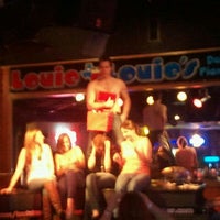 Photo taken at Louie Louie&amp;#39;s Dueling Piano Bar by Aubrie W. on 3/8/2012