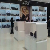 Photo taken at Paris Hilton Store: Handbags &amp;amp; Accessories by Melissa V. on 9/9/2012
