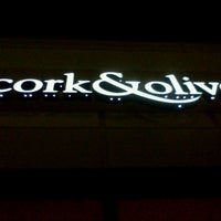 Photo taken at Cork &amp;amp; Olive by Topher A. on 3/9/2011