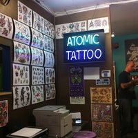 Photo taken at Atomic Tattoo by Kelli☮♡ on 3/28/2012
