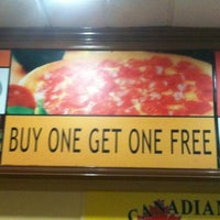 Photo taken at Canadian 2 4 1 Pizza by Azhari B. on 2/13/2012
