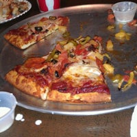 Photo prise au Rusty&amp;#39;s Pizza par April C. le8/27/2011