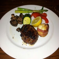 Photo taken at The Keg Steakhouse + Bar - Skyview by Jack D. on 7/16/2012
