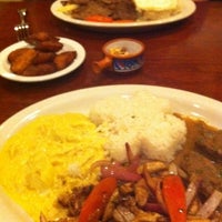 Photo taken at Aji Peruvian Restaurant by Ellen B. on 1/24/2012