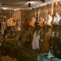 Photo taken at Carmine Street Guitars by Rosa D. on 3/2/2012