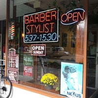Photo taken at Cut N Edge Family Barbershop by Rob P. on 9/28/2011
