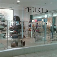 Photo taken at Furla by Marina M. on 4/18/2012
