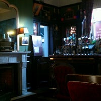 Photo taken at The Library Bar by Paddy O. on 1/9/2012