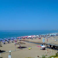 Photo taken at Santa Barbara Beach by Manos K. on 8/26/2012