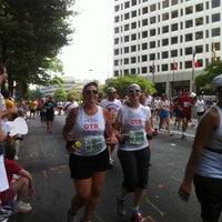 Photo taken at Peachtree Road Race Finish Line by Jenann G. on 7/4/2012